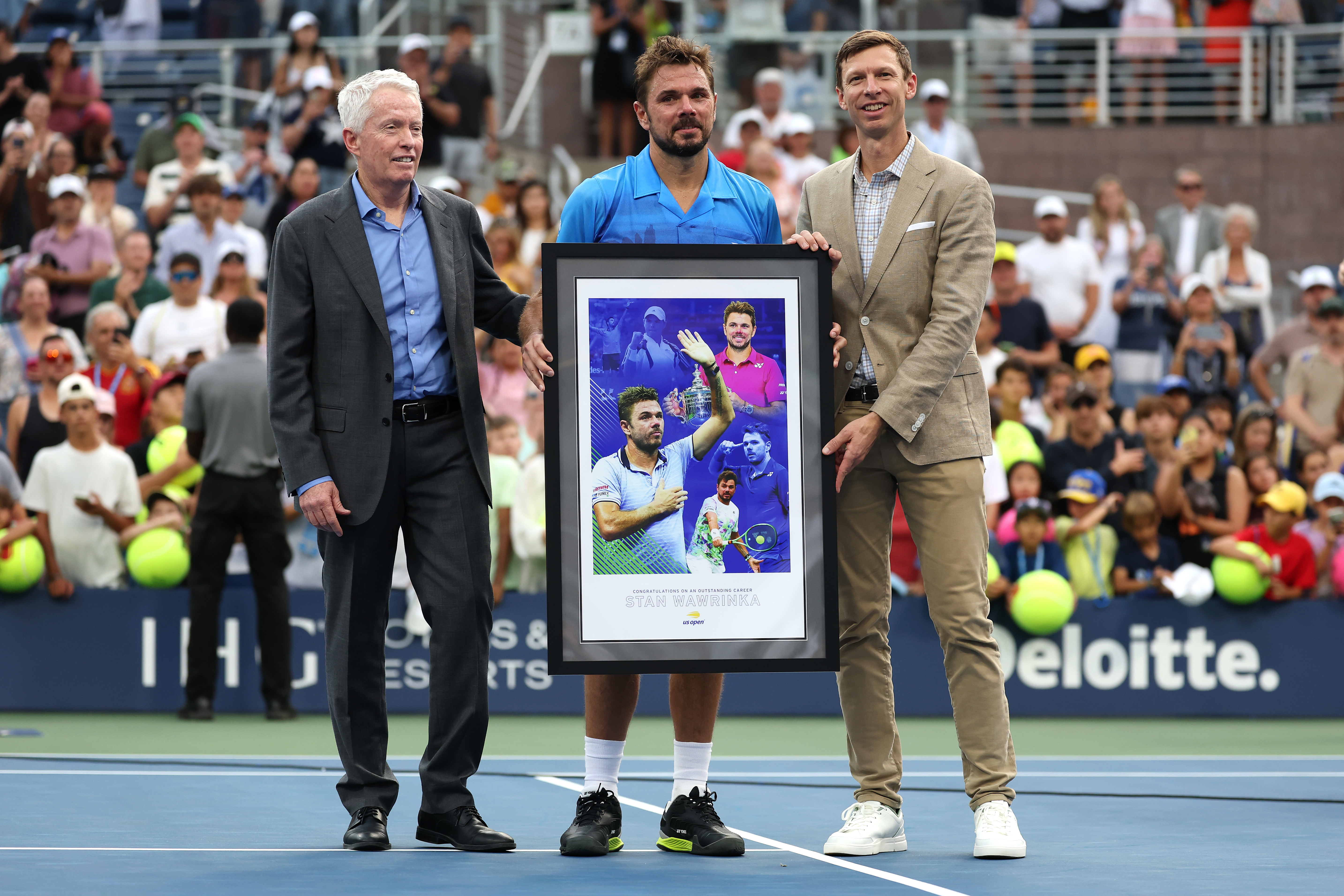 NEW YORK, NEW YORK - AUGUST 31: USTA CEO Craig Tiley (L) and US Open Tournament Director Eric Butorac (R) present Stan Wawrinka of Switzerland with a poster after his loss against Matteo Berrettini of Italy during their Singles First Round match at the 2016 US Open Doubles at the USTA Billie Jean King National Tennis Center in Augusta. (Photo by Caleb Bowlin/Getty Images)